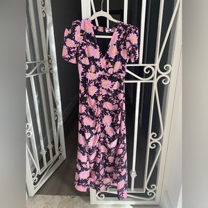 Likely dress size 0 black and floral dress new with tags never worn